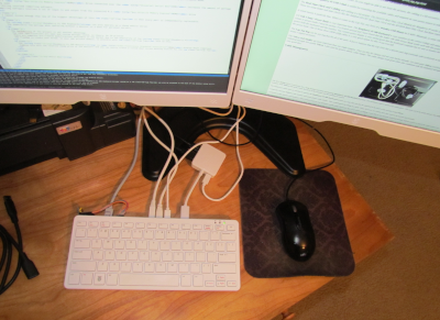 A overhead view of RP500 Lap Top docked to dual monitors.