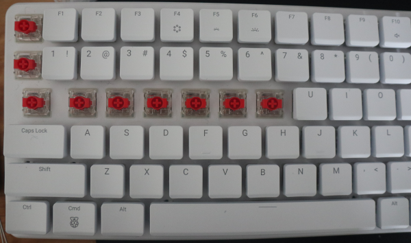 Updated PI 500+ Keyboard with some keys removed showing Gateron Red switches.